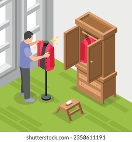 Man preparing spring wardrobe cleaning jacket with brush isometric background 3d vector illustration