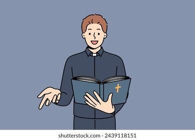 Man priest reads bible and gestures calling on people to accept christian or catholic religion. Positive guy in priest clothes studying sermons and holy scriptures from gospel for work in church