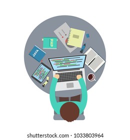Man programmer with laptop sitting top view.