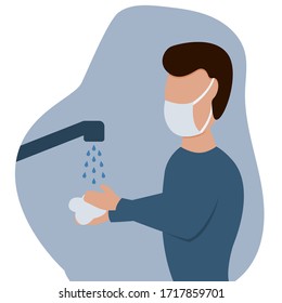 Man in a protective mask washes his hands