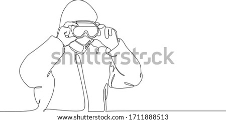 Man in protective suit wearing googles to protect from virus infection