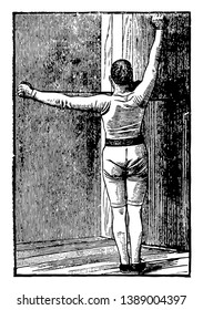 A man is pulling weights for chest exercise. Both of his arms are making 90 degree angle, vintage line drawing or engraving illustration.