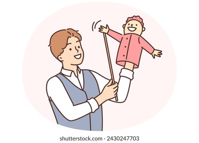 Man puppeteer is preparing to go on stage to show children theater with hand-operated puppets. Guy puppeteer using puppet for business leadership or manipulative employee management concept