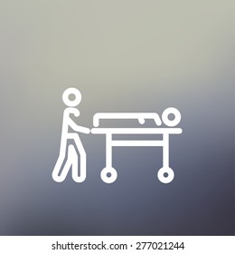 Man pushing the stretcher with sick person icon thin line for web and mobile, modern minimalistic flat design. Vector white icon on gradient mesh background.
