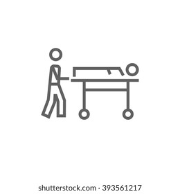 Man pushing stretchers line icon.