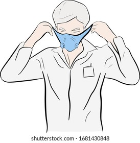 A man puts on a protective mask on his face