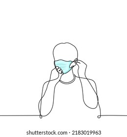 man putting on a mask - one line drawing vector. concept the return of the mask regime, the return of the lockdown, the resumption of the pandemic