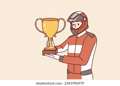 Man racer with golden cup for winning tournament rejoices at receiving championship title in competition. Guy driver, participant in extreme races on cars, demonstrates trophy of racer