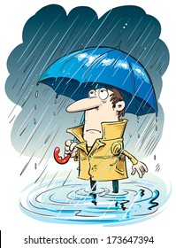 Man in the rain with an umbrella standing in puddle.