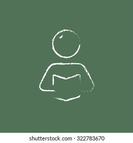 Man reading a book hand drawn in chalk on a blackboard vector white icon isolated on a green background.