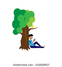 A man reading a book under the tree in the garden.