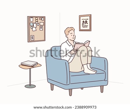 man reading book while sitting on blue sofa in room. Hand drawn style vector design illustrations.