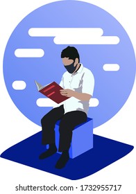 A man reading red book using masker and sitting in cube chair