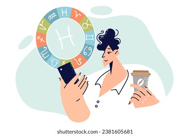 Man reads horoscope on mobile phone and holds cup of coffee in hands standing near zodiac sign pisces. Guy checks astrological forecast in online application with horoscope in smartphone