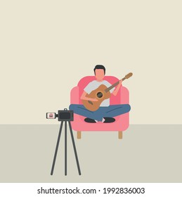 Man recording video with video camera making music