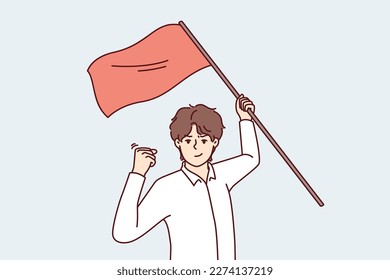 Man with red flag in hand makes victory gesture showing leadership qualities and motivating people. Success guy waving flag during protest showing passionate qualities and wanting to resist injustice