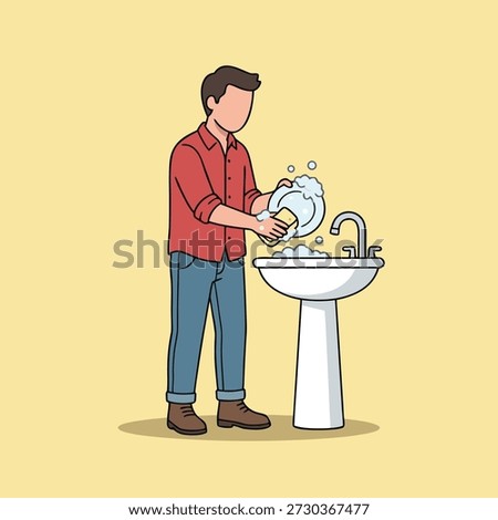 A man in a red shirt and blue jeans is standing at a sink, diligently washing dishes with a sponge and soap, creating suds.