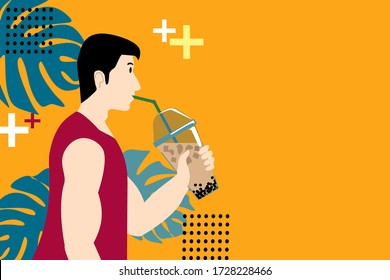 A man In red shirt is drinking bubble milk tea. He is on yellow background and monstera leaves.