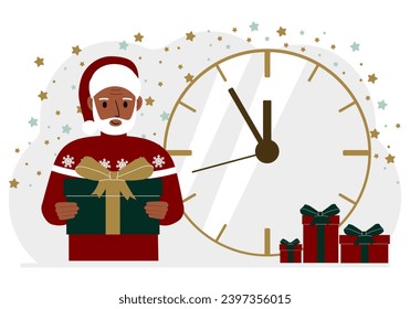 Ein Mann in einem roten Pullover und eine rote Kappe mit einer großen Geschenkbox. 5 Minuten vor Weihnachten oder Neujahr.