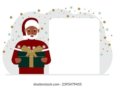 A man in a red sweater is holding a large gift box with a bow. New Year or Christmas.