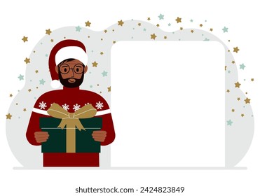 A man in a red sweater is holding a large gift box with a bow. New Year or Christmas.