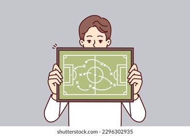 Man referee demonstrates plan for placement of football players teaching athletes tactics of conducting game in soccer. Guy football manager gives recommendation on tactics and strategy of match 