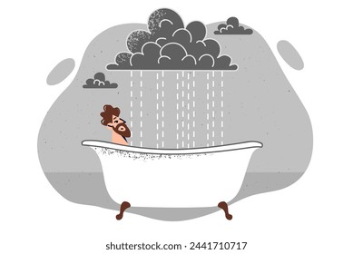 Man relaxes in hot bathtub, relieving stress after work, located under cloud with rain. Pensive guy is lying in bathtub, feeling depressed due to lack of meaning in life and plans for future.