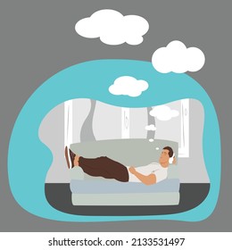 man relaxing on the couch while listening to music