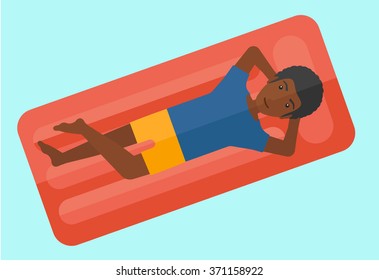 Man relaxing in swimming pool.
