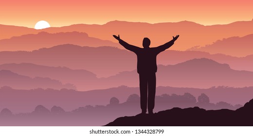 A man relishes his sense of freedom by opening his arms in front of a sun setting over a mountain landscape.
