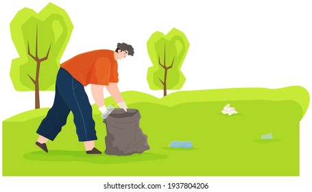 Man is removing plastic and paper waste outdoors during cold season. Guy throws bottle in trash bag