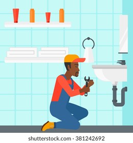 Man repairing sink.