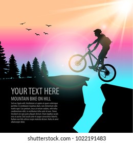 man ride a mountain bike and jump on hill