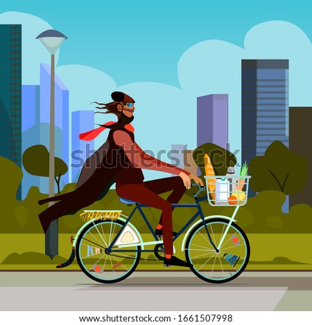 A man rides a bicycle on a background of urban landscape. A traveler bought food and put it in a basket. Strange man on the background of skyscrapers.
