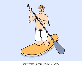 Man rides sup board with oar in hands and smiling looks at screen, encouraging exercise water sports. Guy swims on sup board enjoying active lifestyle, and possibility of visiting sea or ocean