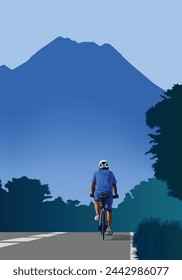 Un hombre montando bicicleta con la montaña azul en el fondo.