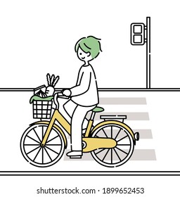 A man riding a bicycle and returning from shopping