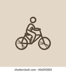 Man riding  bike vector sketch icon isolated on background. Hand drawn Man riding  bike icon. Man riding  bike sketch icon for infographic, website or app.