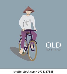 A man riding an old bike going to the field