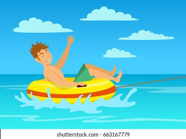 man riding tube at the beach. extreme summer vacation holidays sport fun activity