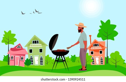 a man roasts meat outdoors. picnic in the countryside. barbecue grill