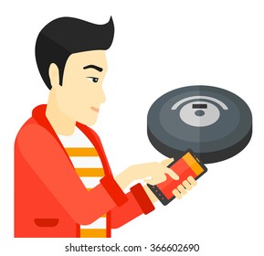Man with robot vacuum cleaner.