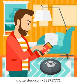 Man with robot vacuum cleaner.