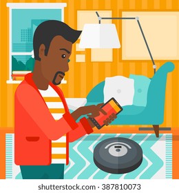 Man with robot vacuum cleaner.
