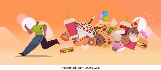 man running away from junk food assortment of fast food unhealthy nutrition junkfood addiction concept