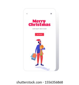 man in santa hat carrying shopping bags and gift present box merry christmas happy new year winter holidays celebration concept smartphone screen online mobile app full length sketch vector