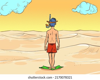 a man in a scuba diving mask stands in front of the desert sands, there is no water. Global warming ecology concept