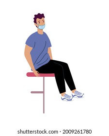 man seated wearing medical mask