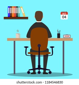 A man is seen working from behind