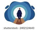 Man sees light at end of tunnel, walking through dark room, for concept of finding way out of difficult situation. Human is looking for way to new level and wants to develop on path to success